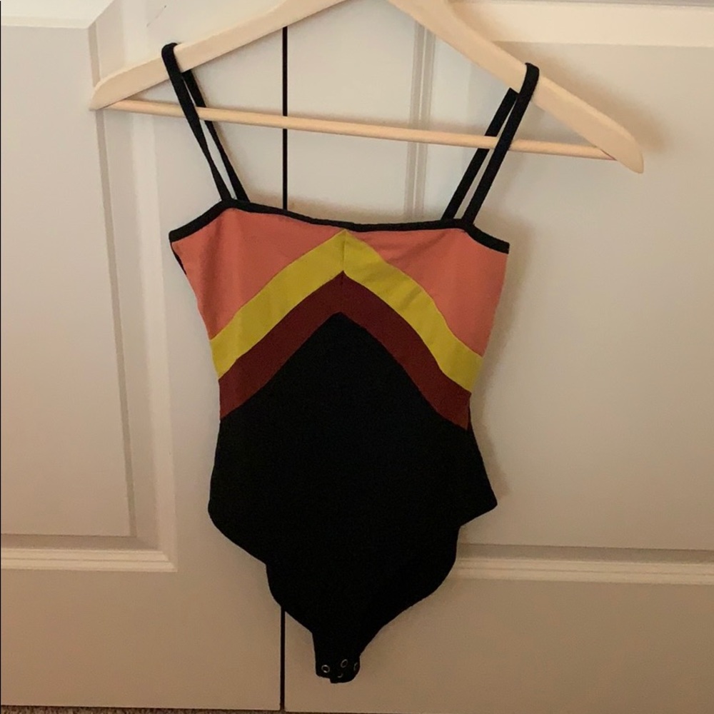 Black yellow and orange bodysuit